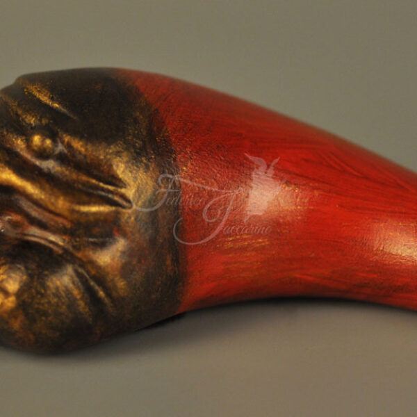 Small horn with mask of Pulcinella C506